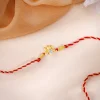 Golden Bloom Lotus Rakhi