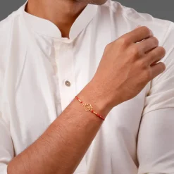 Golden Sacred Bloom Rakhi Combo (Set of 2)