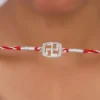 Silver Swastik In Square Rakhi