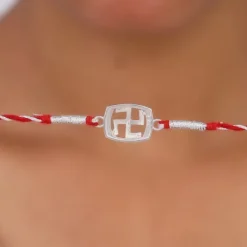 Silver Swastik In Square Rakhi